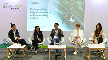 Smiling faces at a booth at the CleanEnviro Summit Singapore event showing scalable solutions for wastewater-energy nexus
