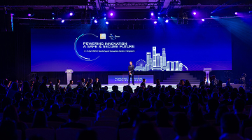 Speaker addresses attendees at the Milipol Asia-Pacific event, highlighting modern security challenges.